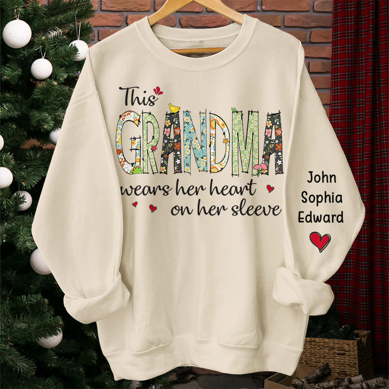 Wears Her Heart On Her Sleeve - Family Personalized Custom Unisex Sweatshirt With Design On Sleeve - Christmas Gift For Mom, Grandma