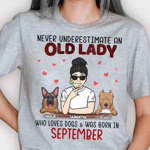Never Underestimate An Old Lady Who Loves Dogs - Personalized Unisex T-Shirt.